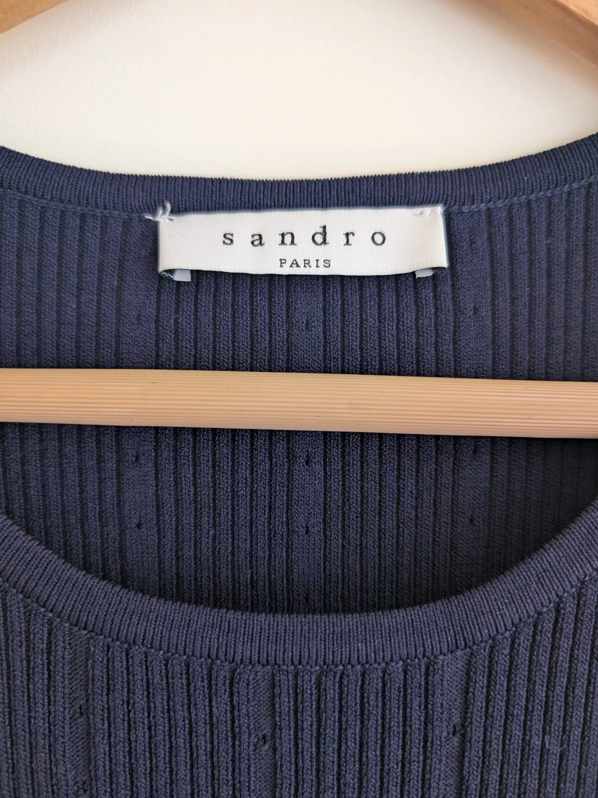 SANDRO Paris brand label inside the navy ribbed knit top
